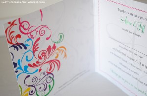 swirly rainbow coloured wedding invites