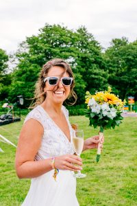 festival bride wearing her festival wristbands from wedfest