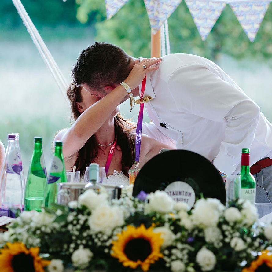 bride and groom kiss