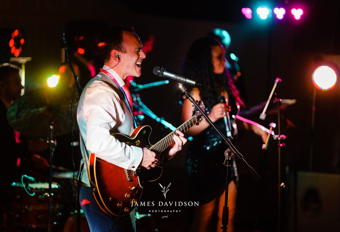 festival wedding groom singing & playing guitar