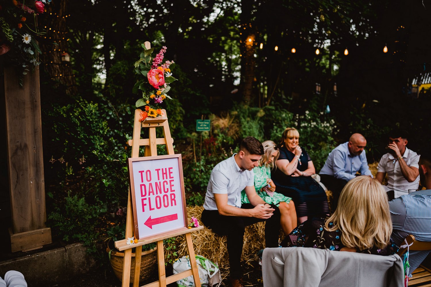 to the dance floor wedding sign